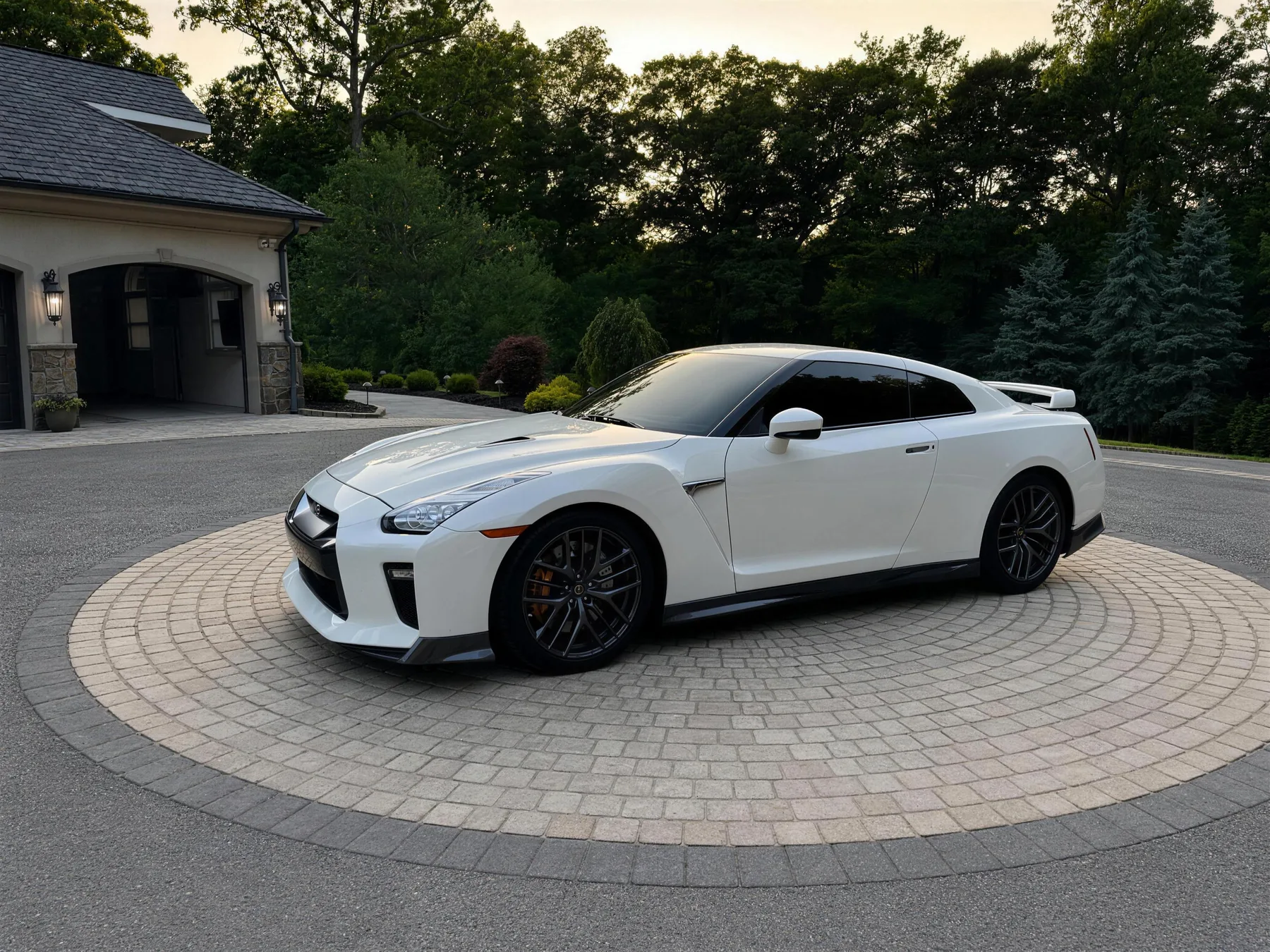 White Nissan GT-R with ceramic tint on a paver driveway