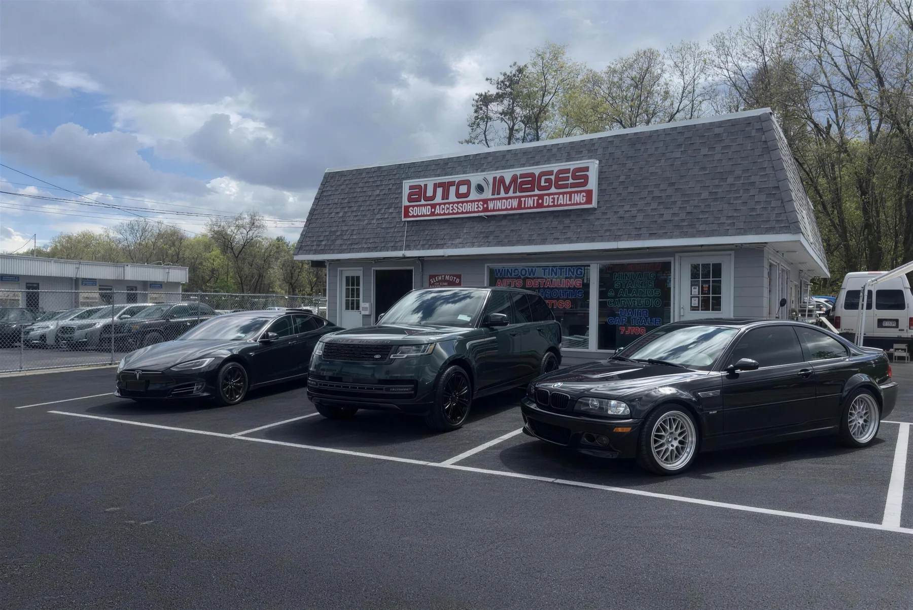 Tesla Model S, Range Rover and E46 BMW M3 with fresh window tint at the Auto Images shop